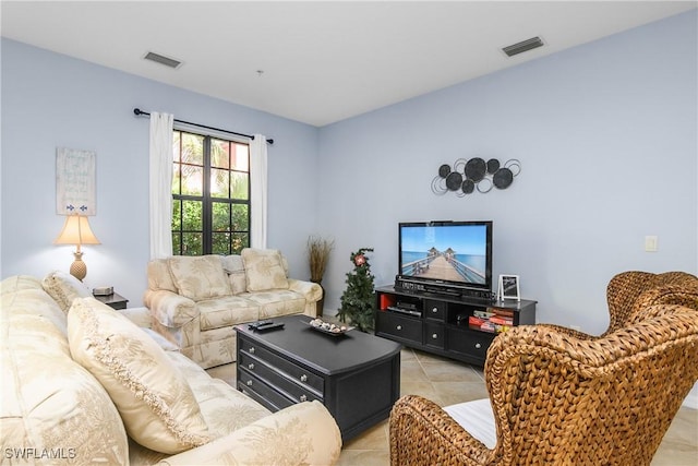 living room with light tile patterned flooring