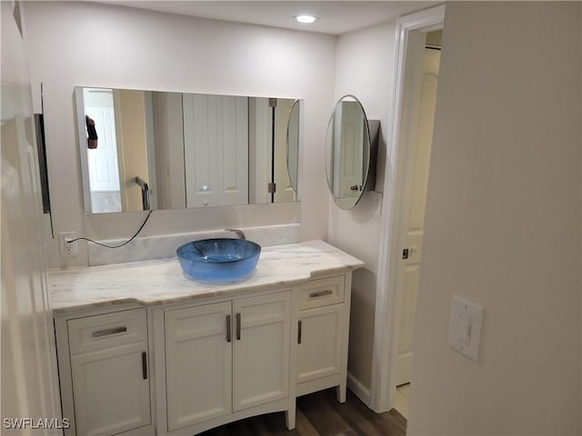 bathroom featuring vanity and hardwood / wood-style flooring