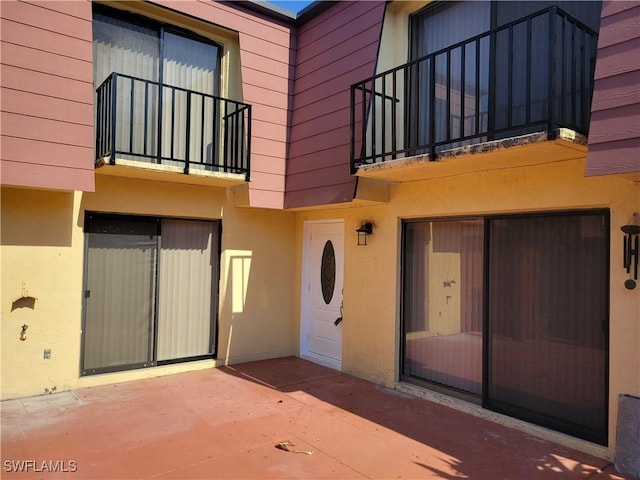 property entrance with a patio area