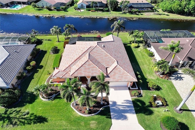 birds eye view of property with a water view