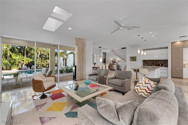 tiled living room featuring ceiling fan