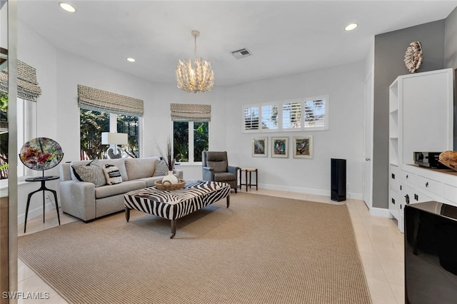 tiled living room featuring a chandelier and a wealth of natural light