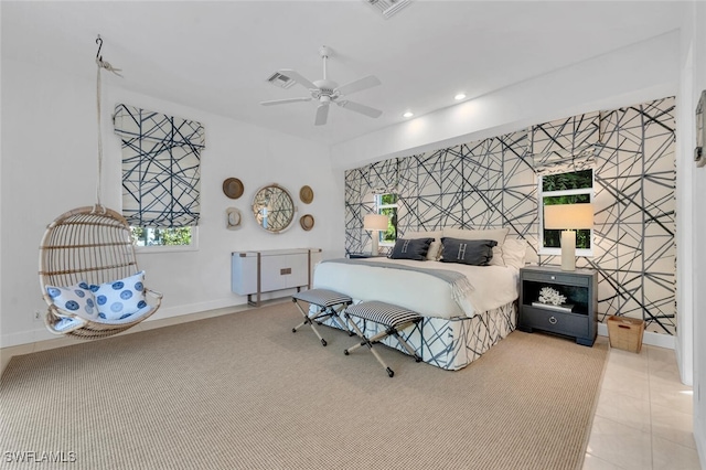 bedroom with ceiling fan and light tile patterned floors