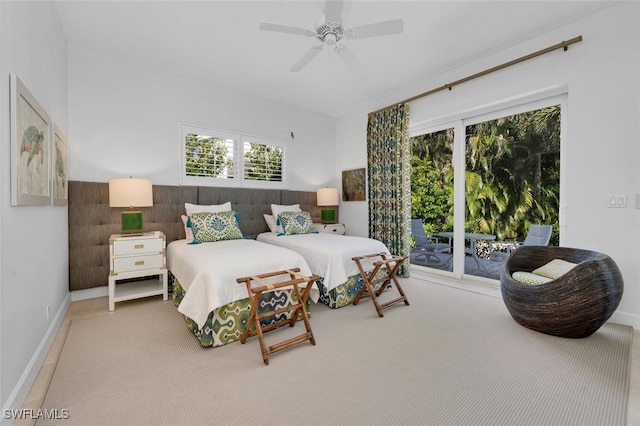 bedroom featuring carpet flooring, ceiling fan, and multiple windows