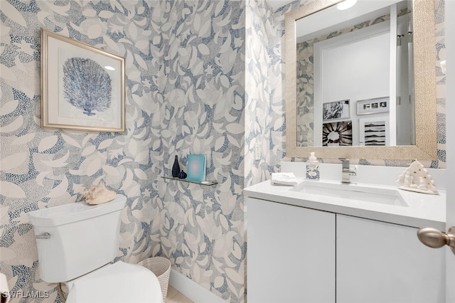 bathroom featuring vanity and toilet