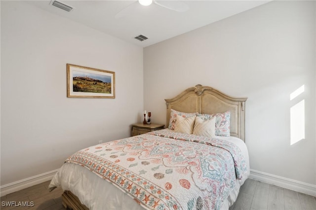 bedroom featuring hardwood / wood-style floors and ceiling fan