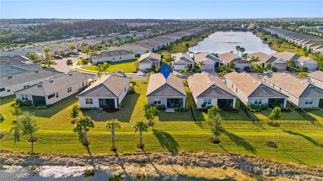 birds eye view of property featuring a water view