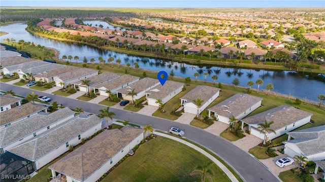 drone / aerial view with a water view