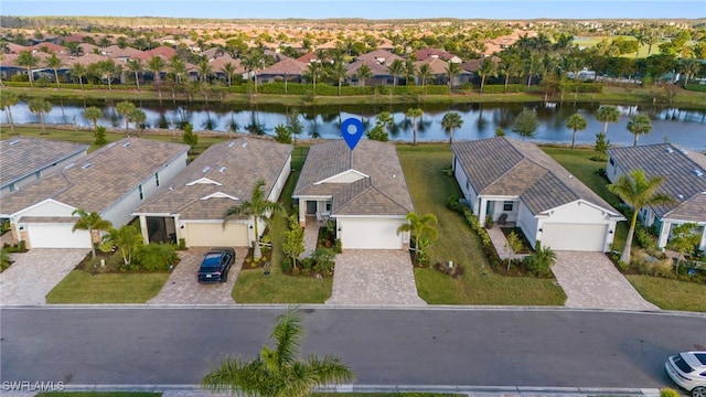 bird's eye view with a water view