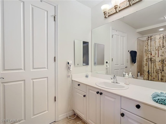 bathroom with a shower with shower curtain and vanity