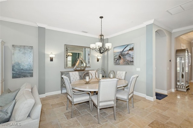 dining area featuring crown molding and a chandelier