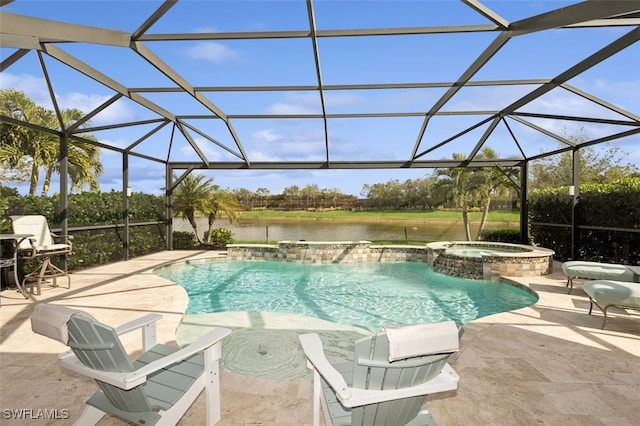 view of pool with an in ground hot tub, pool water feature, a water view, glass enclosure, and a patio area