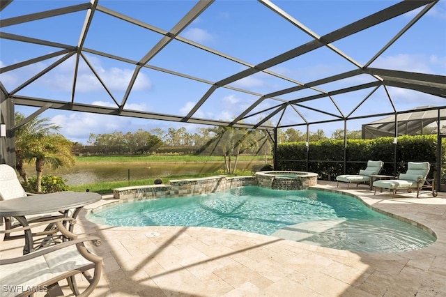 view of pool featuring glass enclosure, pool water feature, a patio area, an in ground hot tub, and a water view