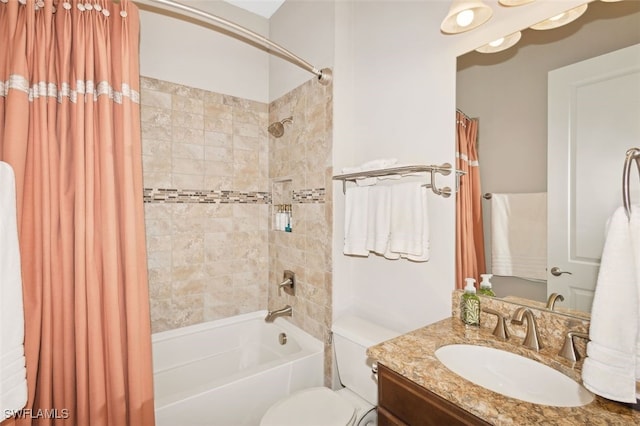 full bathroom featuring shower / bath combo, vanity, and toilet