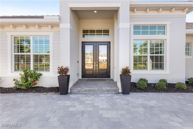 property entrance featuring french doors