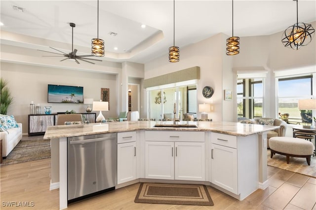 15844 Cranes Marsh Ct, Punta Gorda, FL 33982 - kitchen featuring dishwasher, open floor plan, light wood-style flooring, a high ceiling, and recessed lighting