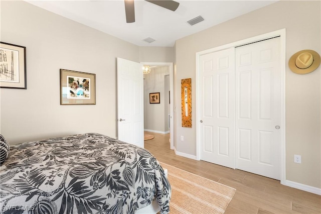 15844 Cranes Marsh Ct, Punta Gorda, FL 33982 - bedroom featuring light wood-type flooring, a closet, and a ceiling fan
