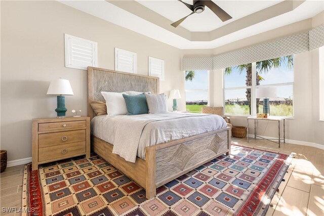 15844 Cranes Marsh Ct, Punta Gorda, FL 33982 - bedroom with ceiling fan and a tray ceiling