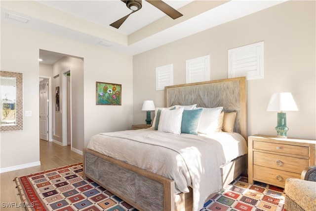 bedroom featuring ceiling fan and dark wood-type flooring