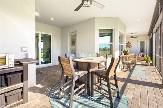 view of patio / terrace featuring ceiling fan