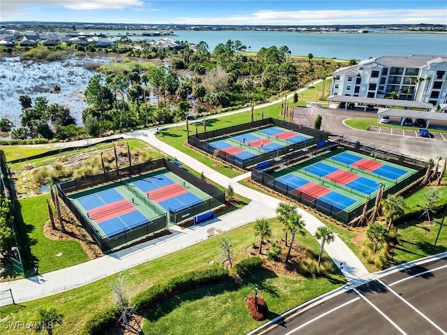 birds eye view of property with a water view