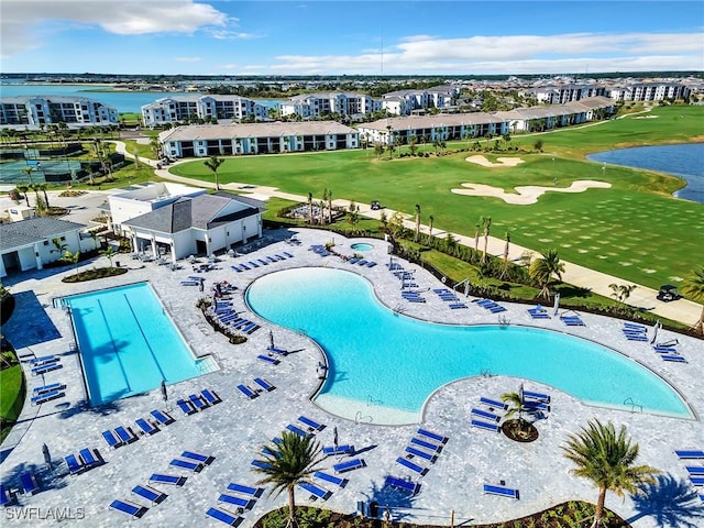 view of swimming pool with a water view