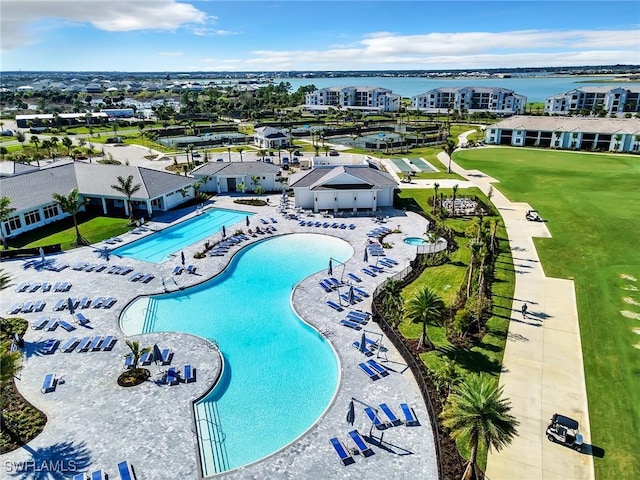 view of pool with a water view