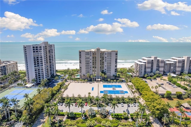 birds eye view of property featuring a water view and a view of the beach