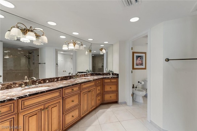 bathroom with vanity, a shower with door, tile patterned floors, and a bidet