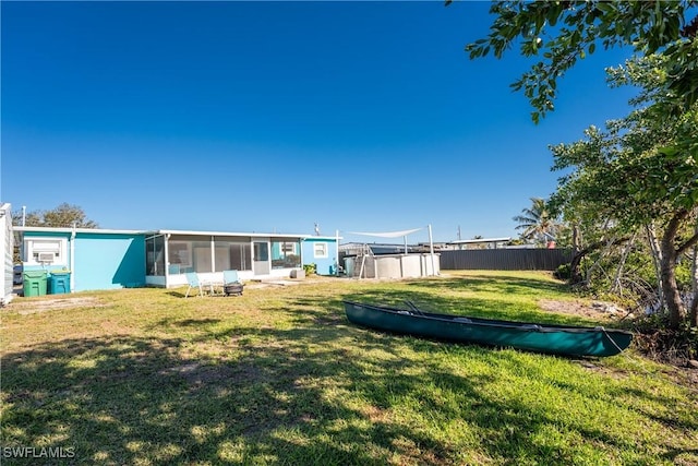 view of yard with a sunroom