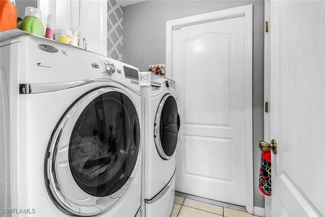 709 SW 9th Ct, Cape Coral, FL 33991 - laundry room with independent washer and dryer and light tile patterned floors