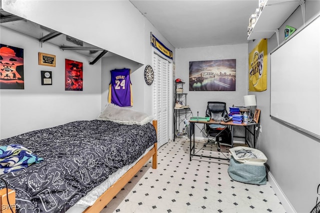 709 SW 9th Ct, Cape Coral, FL 33991 - bedroom featuring tile patterned floors, a desk, a closet, and baseboards