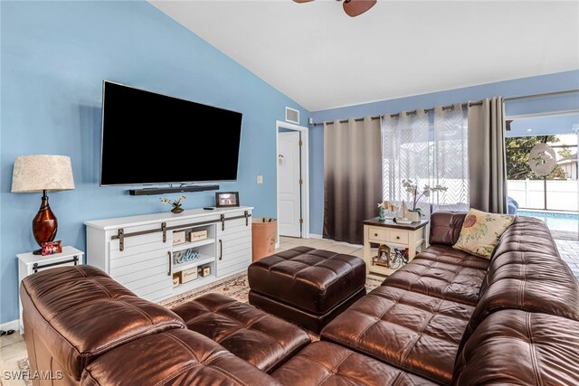 709 SW 9th Ct, Cape Coral, FL 33991 - living area featuring lofted ceiling, ceiling fan, tile patterned flooring, and baseboards