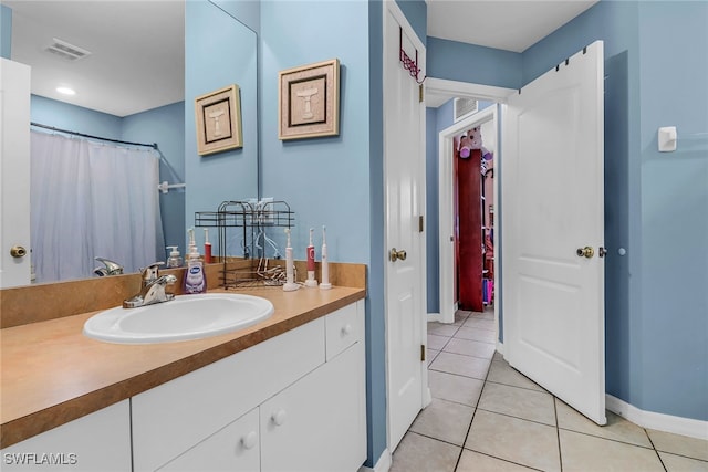 bathroom with tile patterned floors, vanity, and a shower with shower curtain