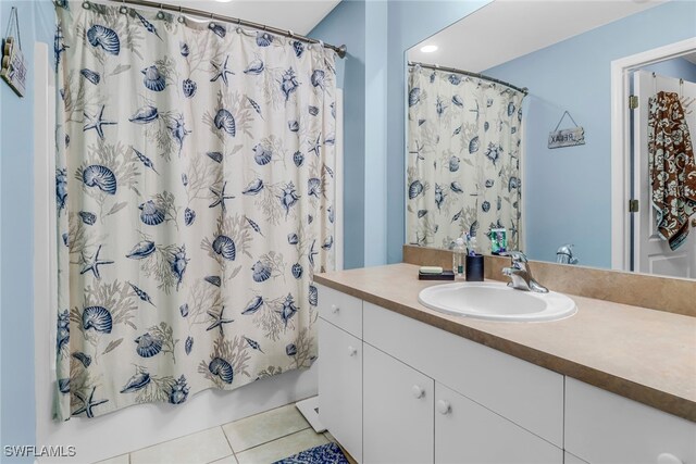 709 SW 9th Ct, Cape Coral, FL 33991 - bathroom featuring vanity, tile patterned flooring, shower / bathtub combination with curtain, and recessed lighting