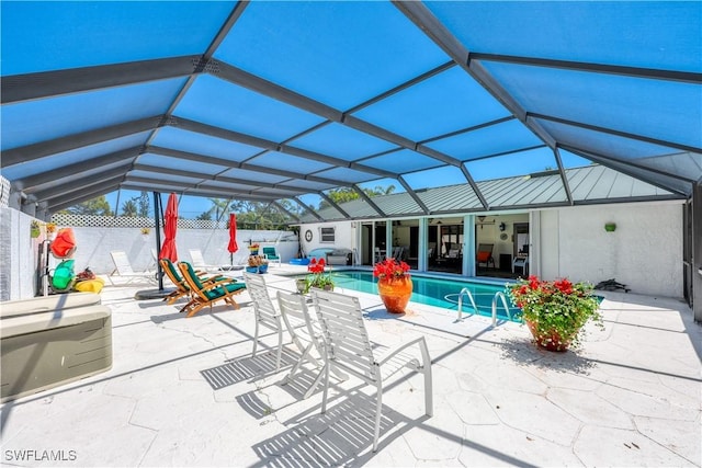 view of pool featuring a lanai and a patio area