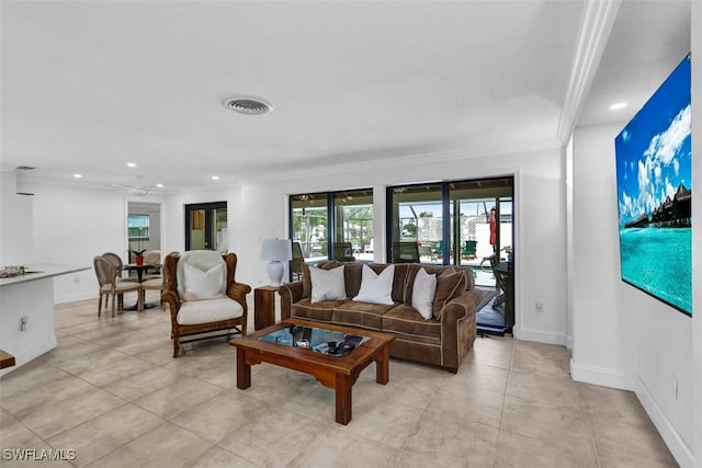 living room featuring crown molding, ceiling fan, and light tile patterned floors