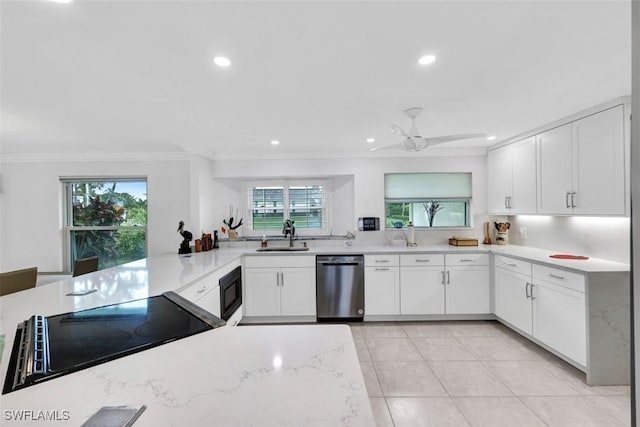 kitchen with plenty of natural light, white cabinets, and black appliances