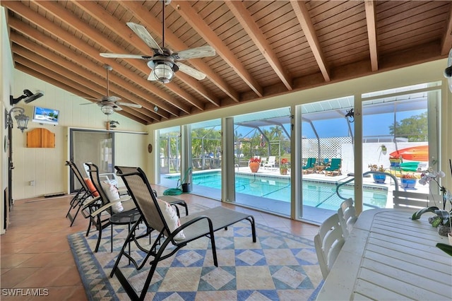 sunroom / solarium with vaulted ceiling with beams, a water view, ceiling fan, and wood ceiling