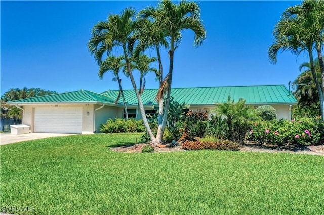 ranch-style home with a garage and a front yard