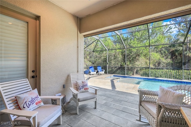 view of patio featuring a lanai and an outdoor pool