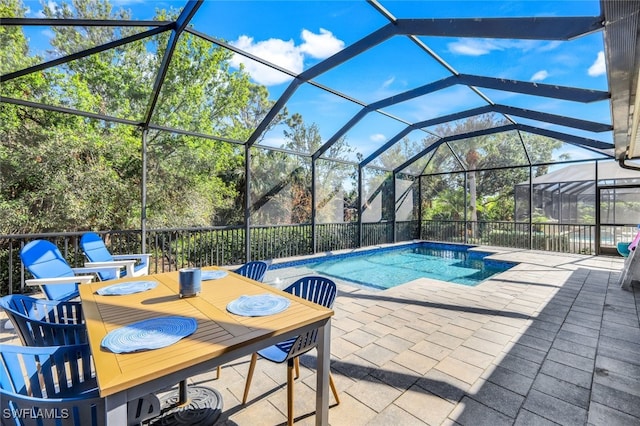 outdoor pool featuring a lanai and a patio