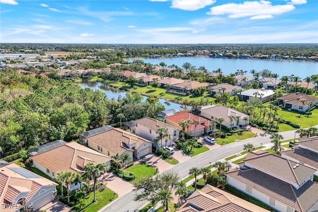 bird's eye view with a water view and a residential view