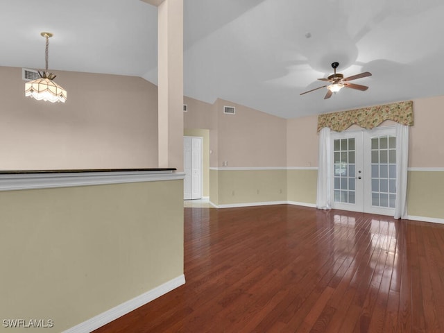 unfurnished living room with hardwood / wood-style flooring, ceiling fan, lofted ceiling, and french doors