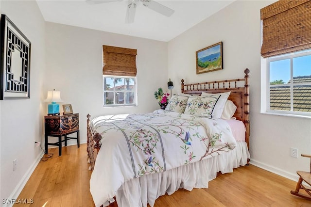 bedroom with ceiling fan and wood-type flooring