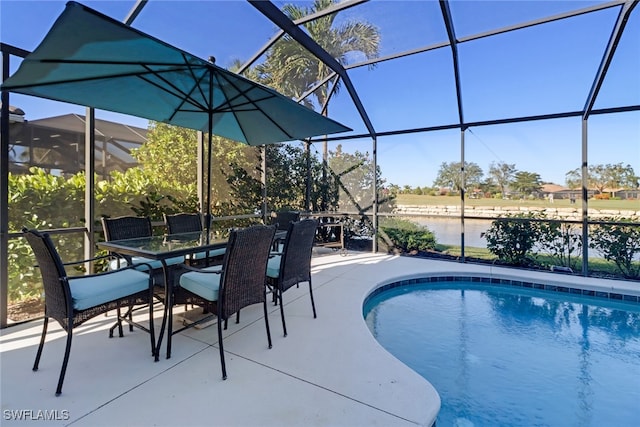 view of swimming pool featuring glass enclosure, a water view, and a patio