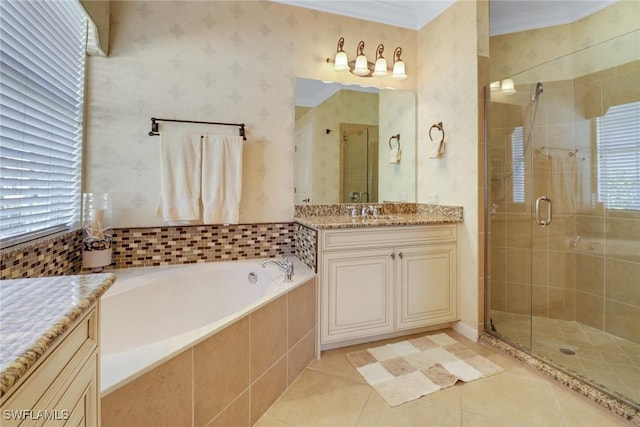 bathroom featuring tile patterned floors, vanity, shower with separate bathtub, and crown molding