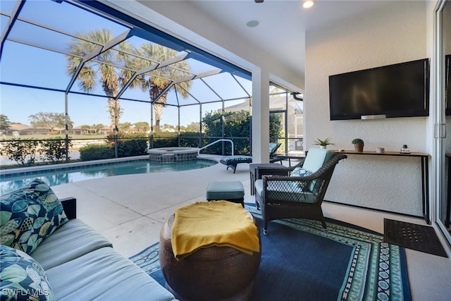 view of swimming pool with a lanai, an outdoor hangout area, an in ground hot tub, and a patio