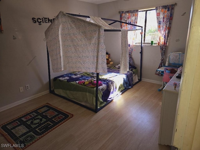 bedroom with light hardwood / wood-style flooring