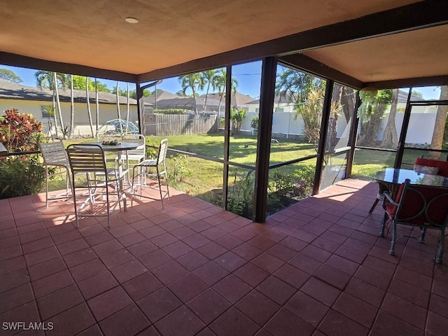 unfurnished sunroom with a wealth of natural light